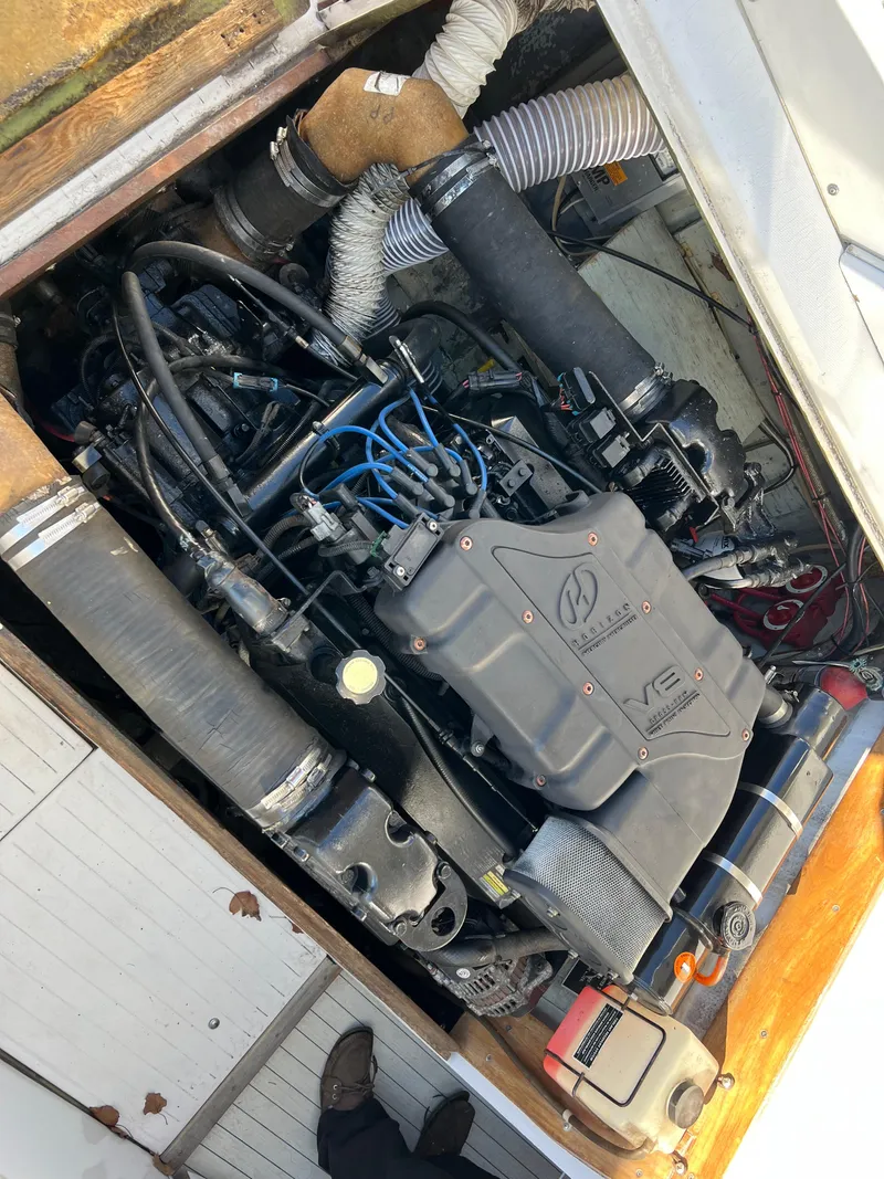 Slide: The Image of Engine compartment of a 1973 Bertram 31 Flybridge Cruiser with visible components. - 47