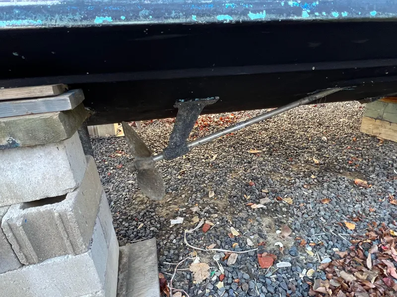 Slide: The Image of 1973 Bertram 31 Flybridge Cruiser propeller and shaft on cinder blocks. - 8