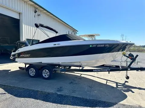 The Image of 2023 Monterey M-225 boat on trailer outside a warehouse. - 0