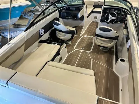Slide: The Image of 2023 Monterey M-225 boat interior with beige seating and modern dashboard. - 5