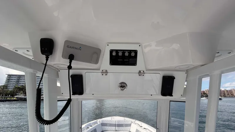 Slide: The Image of 2024 Sea Fox 268 Commander helm with Garmin electronics, overlooking water. - 16