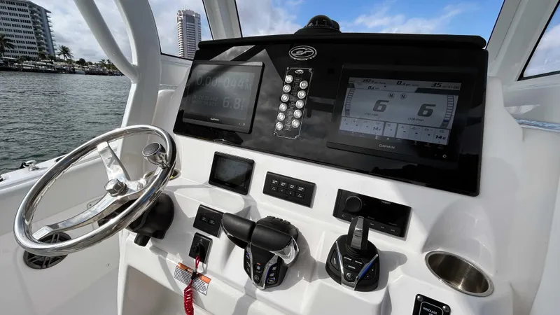 Slide: The Image of 2024 Sea Fox 268 Commander boat dashboard with modern controls and navigation displays. - 19