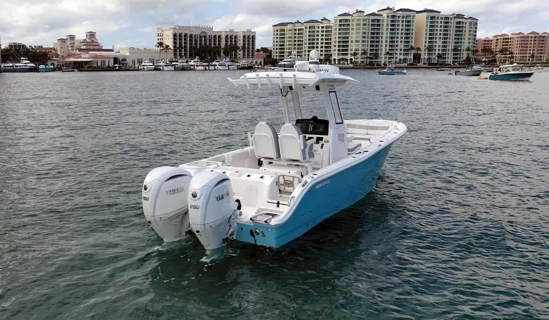 Slide: The Image of 2024 Sea Fox 268 Commander boat on water with twin Yamaha engines. - 5