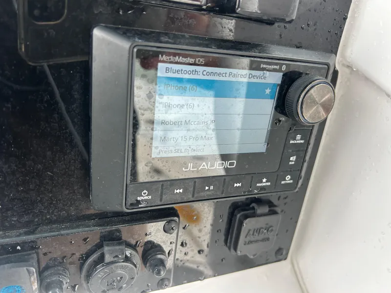 Slide: The Image of JL Audio system on 2024 Sea Hunt Gamefish 27 boat, displaying Bluetooth connections. - 20