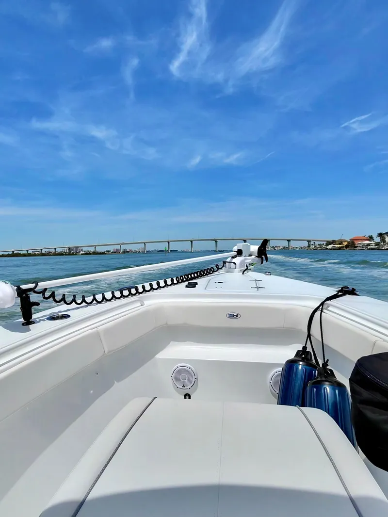 Slide: The Image of 2024 Sea Hunt Gamefish 27 with Coffin Box on water under blue sky. - 22