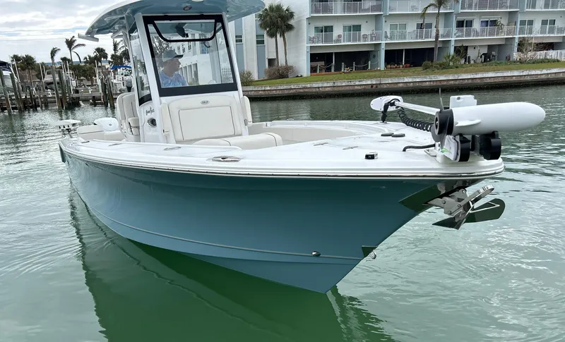 Slide: The Image of 2024 Sea Hunt Gamefish 27 boat with coffin box on calm water. - 3