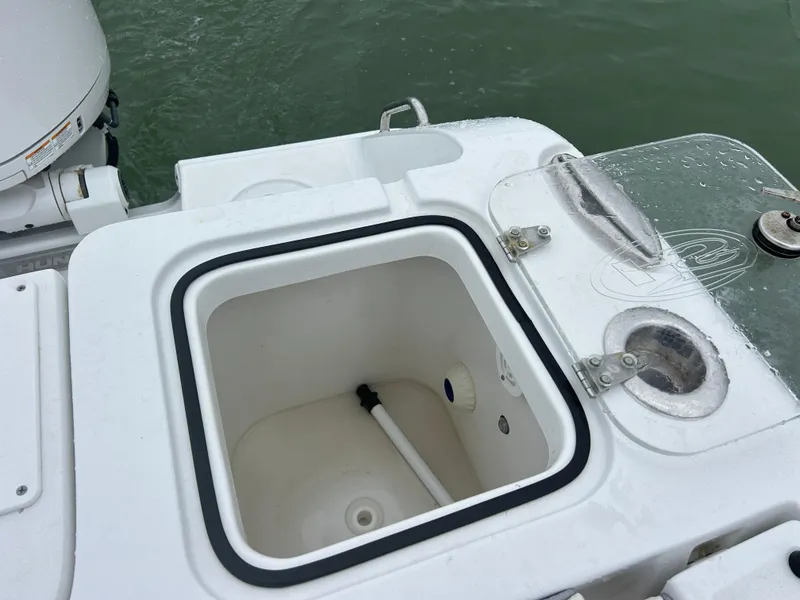 Slide: The Image of 2024 Sea Hunt Gamefish 27 boat with open coffin box and fishing features. - 34