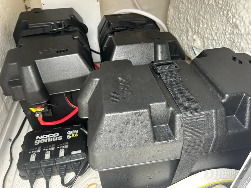 Slide: The Image of Battery compartment of 2024 Sea Hunt Gamefish 27 with Noco Genius charger. - 45