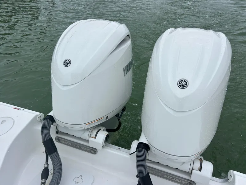 Slide: The Image of 2024 Sea Hunt Gamefish 27 boat with twin Yamaha outboard engines. - 7