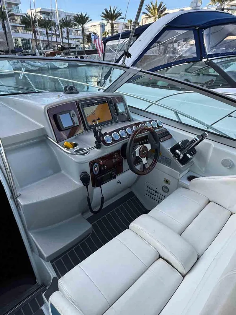 Slide: The Image of 2005 Formula 31 Performance Cruiser cockpit with modern navigation equipment and plush seating. - 12