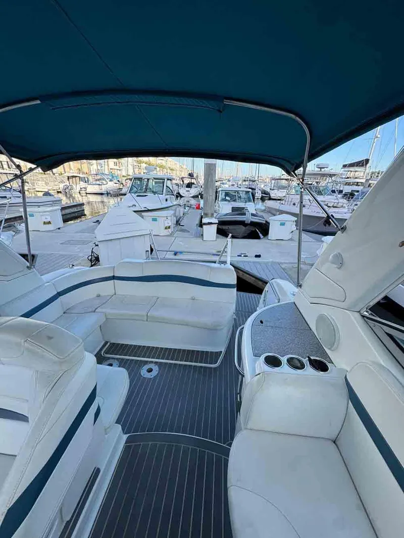 Slide: The Image of 2005 Formula 31 Performance Cruiser with spacious seating, docked at a marina. - 13