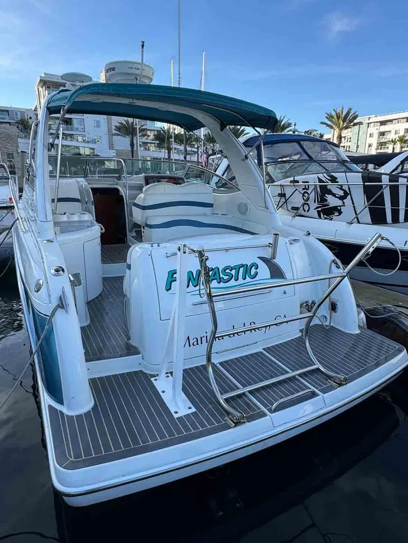 Slide: The Image of 2005 Formula 31 Performance Cruiser docked, featuring spacious deck and seating area. - 15