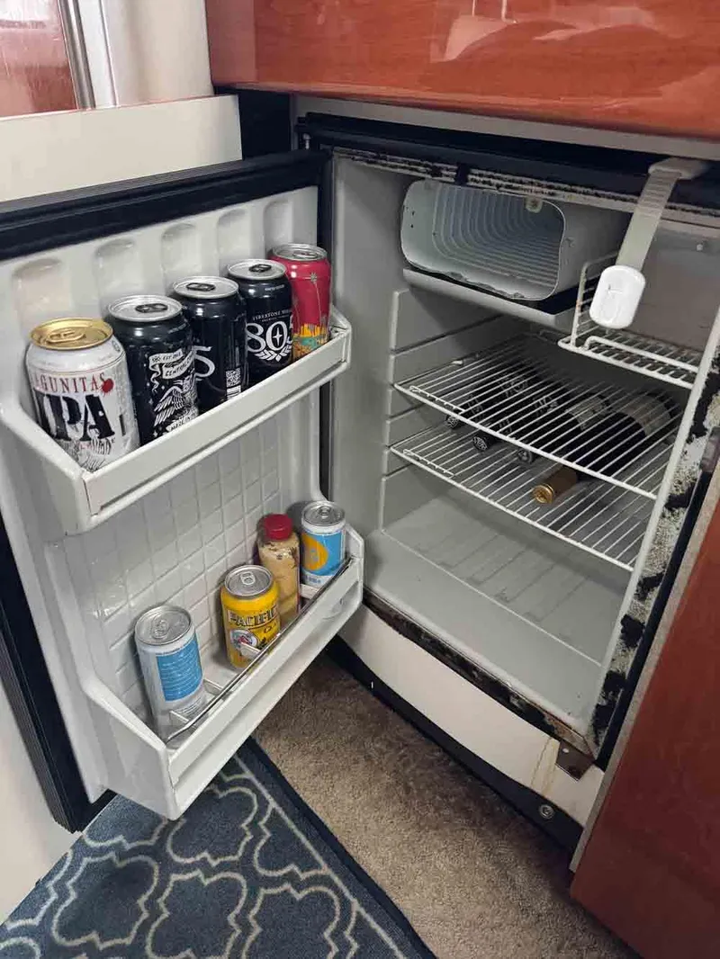 Slide: The Image of Mini fridge in 2005 Formula 31 Performance Cruiser with assorted beverage cans. - 25