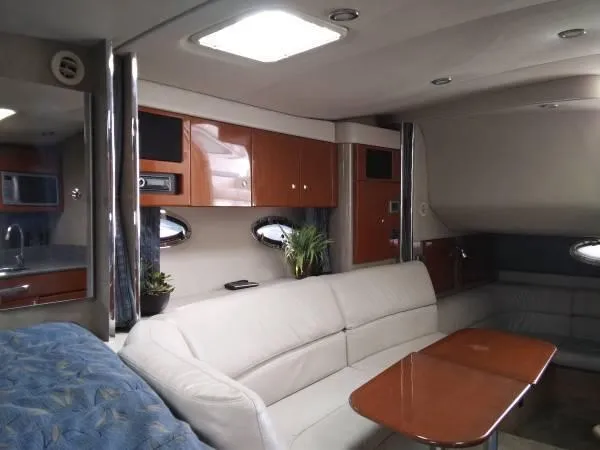 Slide: The Image of Luxurious interior of a 2005 Formula 31 Performance Cruiser with modern amenities and elegant design. - 29