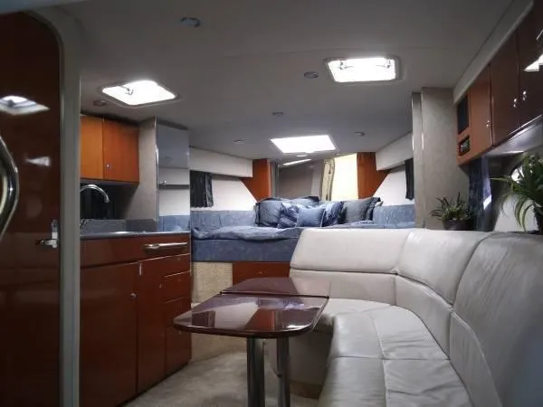 Slide: The Image of Interior of 2005 Formula 31 Performance Cruiser with modern kitchen and cozy seating area. - 30