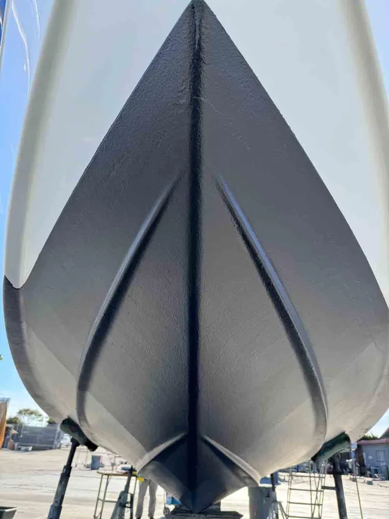 Slide: The Image of 2005 Formula 31 Performance Cruiser boat hull, dry docked, showcasing sleek design. - 5