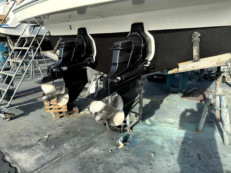 Slide: The Image of 2005 Formula 31 Performance Cruiser with dual propellers in a boatyard setting. - 9