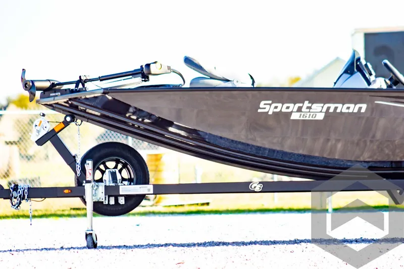 Slide: The Image of 2025 G3 Sportsman 1610 boat on trailer, side view, outdoors. - 12