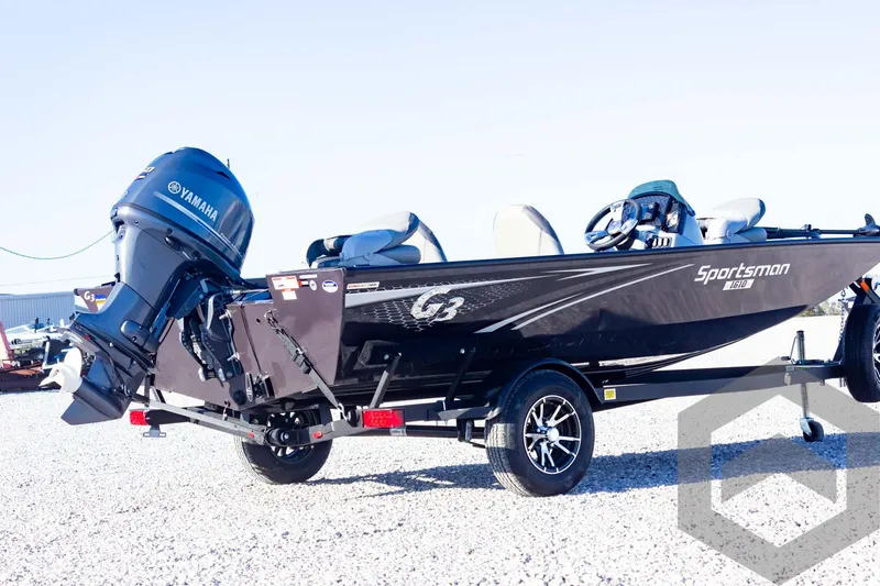 Slide: The Image of 2025 G3 Sportsman 1610 boat with Yamaha engine on gravel lot. - 16