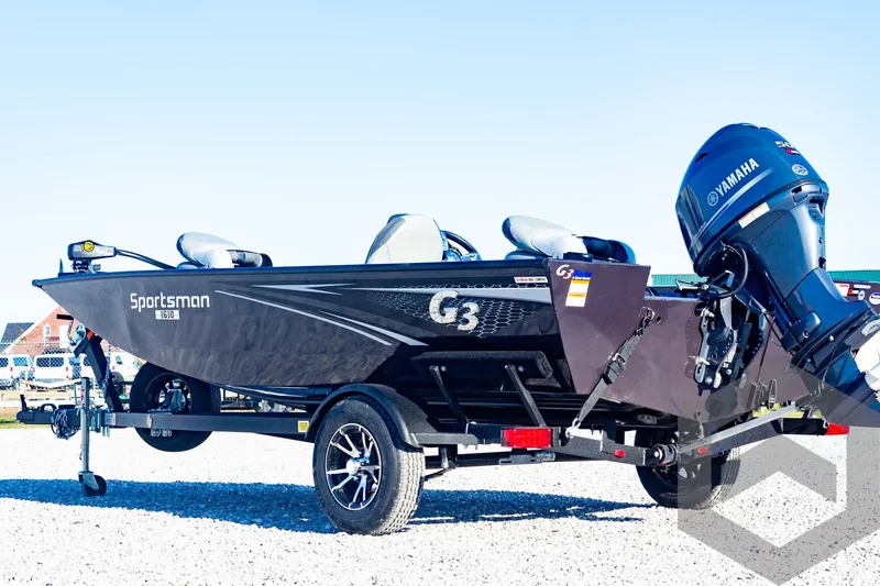 Slide: The Image of 2025 G3 Sportsman 1610 boat with Yamaha motor on trailer, parked outdoors. - 17