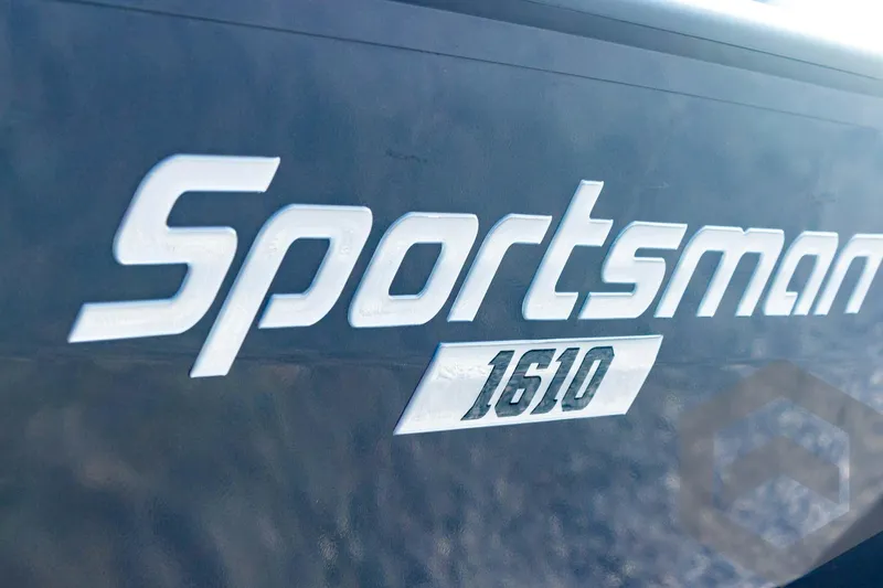 Slide: The Image of Close-up of 2025 G3 Sportsman 1610 logo on boat exterior. - 21