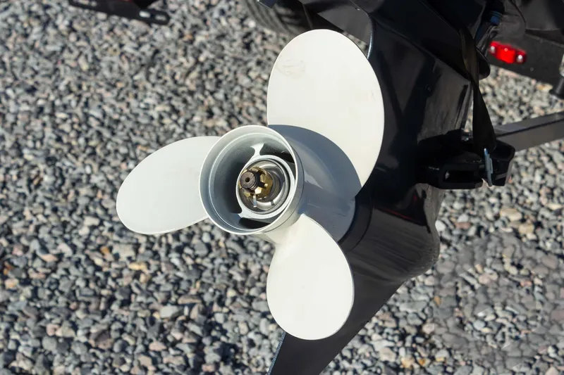 Slide: The Image of Close-up of a 2025 G3 Sportsman 1610 boat propeller on gravel surface. - 27