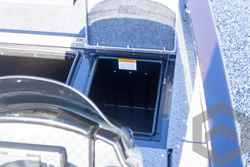 Slide: The Image of 2025 G3 Sportsman 1610 boat storage compartment with open lid, showcasing interior space. - 39