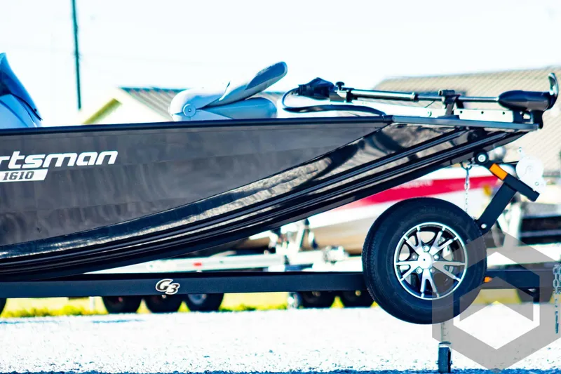 Slide: The Image of 2025 G3 Sportsman 1610 boat on trailer, sleek design, black finish. - 4