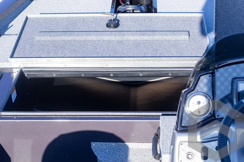 Slide: The Image of 2025 G3 Sportsman 1610 boat storage compartment with open lid, showcasing interior space. - 41