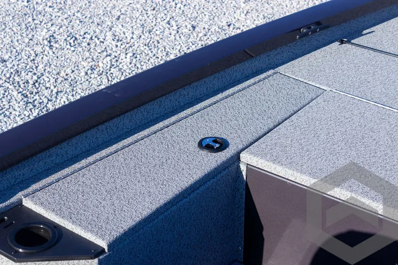 Slide: The Image of 2025 G3 Sportsman 1610 boat deck with textured surface and storage compartment. - 42