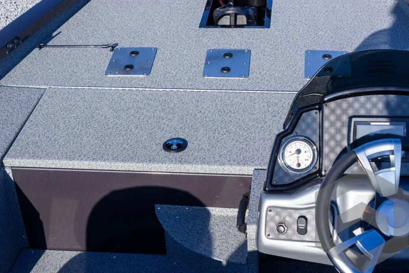 Slide: The Image of 2025 G3 Sportsman 1610 boat interior with steering wheel and dashboard controls. - 43
