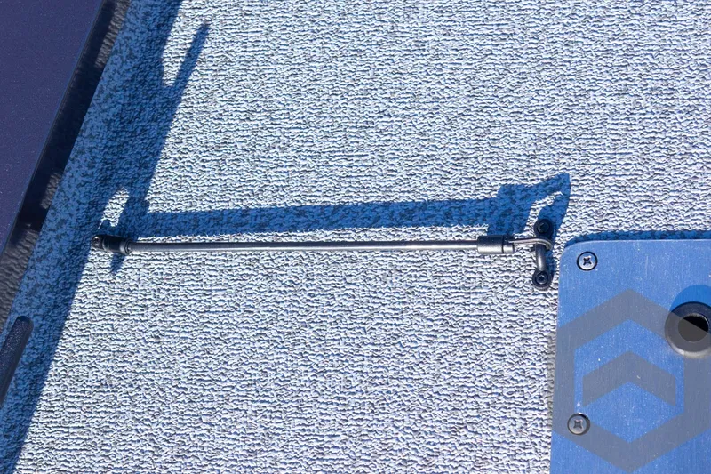 Slide: The Image of 2025 G3 Sportsman 1610 boat deck with latch and textured surface. - 47