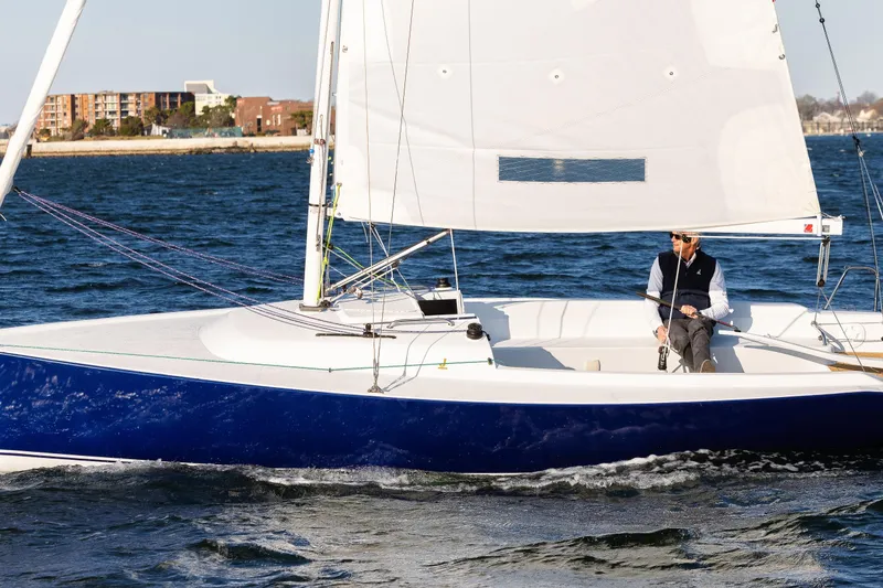 Slide: The Image of 2026 J Boats J/7 sailing on open water with a person at the helm. - 3