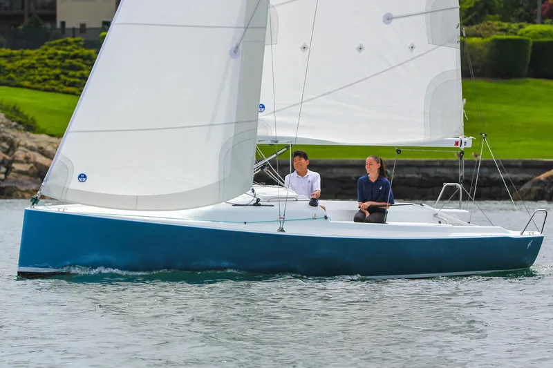 Slide: The Image of 2026 J Boats J/7 sailboat with two people sailing on calm water. - 6