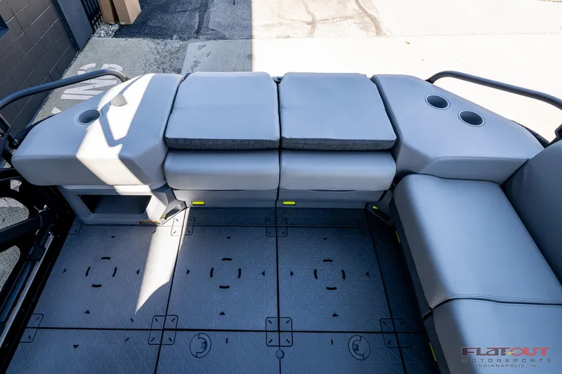 Slide: The Image of 2024 Sea-Doo Switch SPORT 21 230HP boat interior with cushioned seating and cup holders. - 13