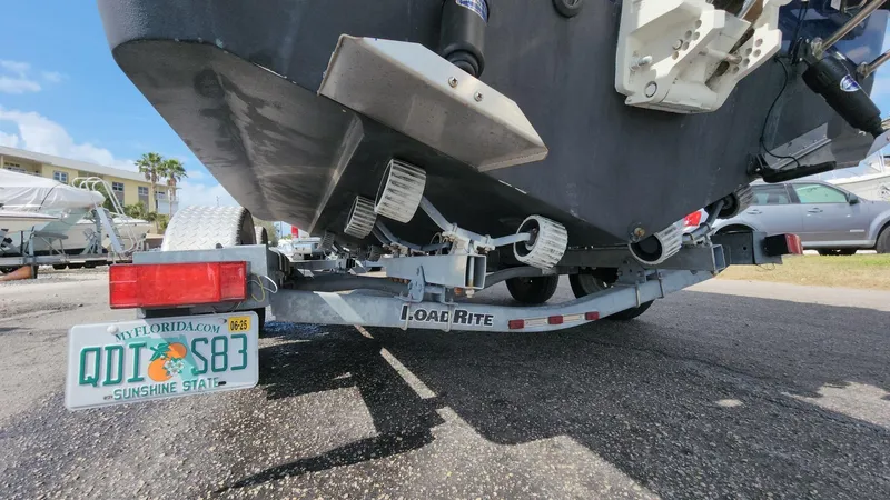 Slide: The Image of 2014 Striper 220 Center Console on Load Rite trailer, Florida license plate visible. - 26