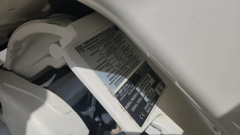 Slide: The Image of Label on 2014 Striper 220 Center Console boat component, showing specifications and safety information. - 41