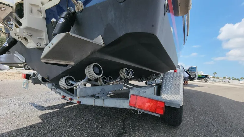 Slide: The Image of 2014 Striper 220 Center Console boat on trailer, rear view, sunny day. - 43