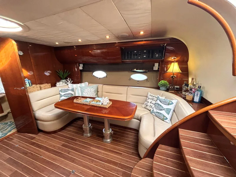 Slide: The Image of Luxurious 2005 Viking Princess V50 yacht interior with elegant seating and wooden finishes. - 3
