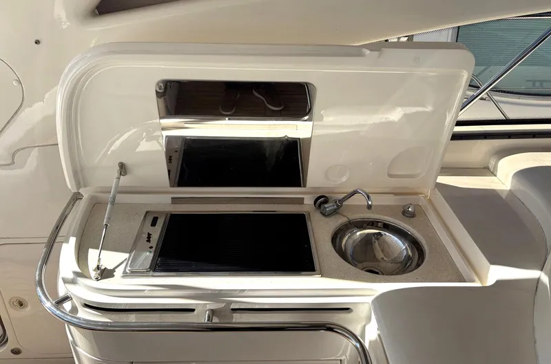 Slide: The Image of 2005 Viking Princess V50 yacht kitchenette with stove and sink. - 41