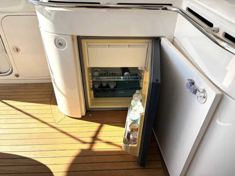Slide: The Image of Open mini fridge on 2005 Viking Princess V50 yacht with drinks inside. - 42