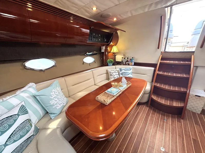 Slide: The Image of Luxurious 2005 Viking Princess V50 yacht interior with elegant seating and wooden table. - 47