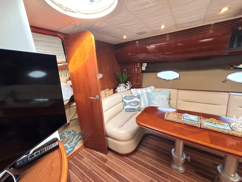 Slide: The Image of Luxurious 2005 Viking Princess V50 yacht interior with elegant seating and wooden finishes. - 48