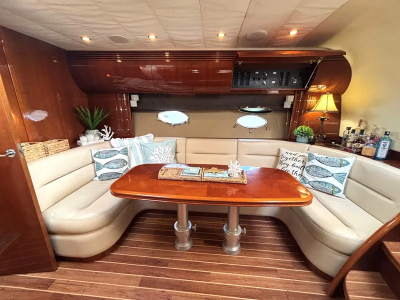 Slide: The Image of Luxurious 2005 Viking Princess V50 yacht interior with elegant seating and wooden table. - 50