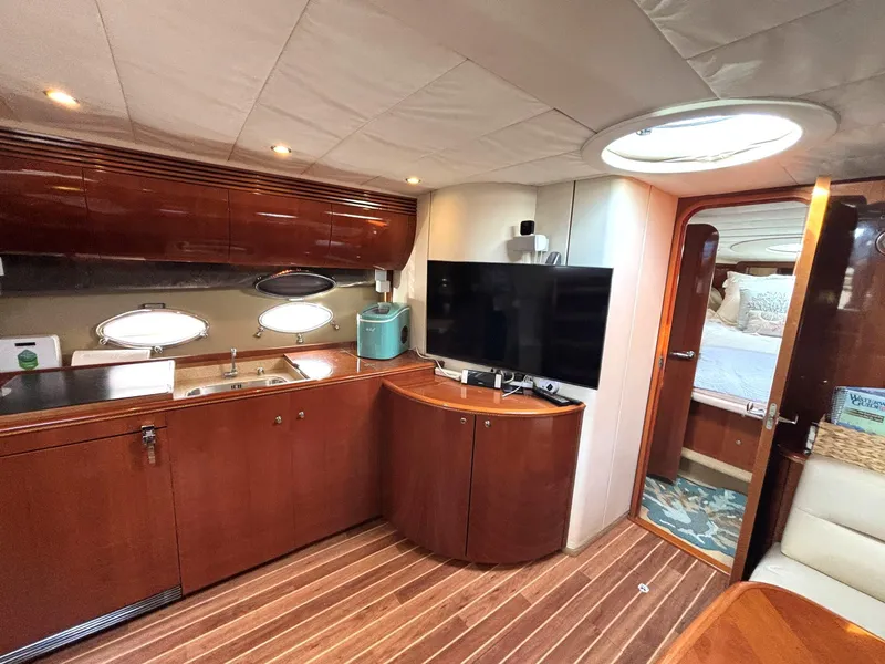 Slide: The Image of Luxurious interior of 2005 Viking Princess V50 yacht with modern kitchen and entertainment area. - 53
