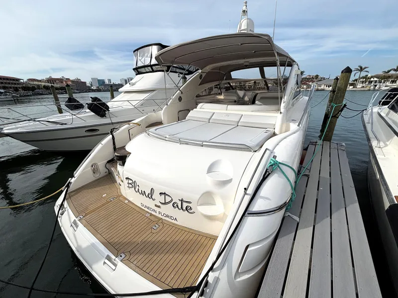 Slide: The Image of 2005 Viking Princess V50 yacht docked at marina, named "Blind Date." - 9