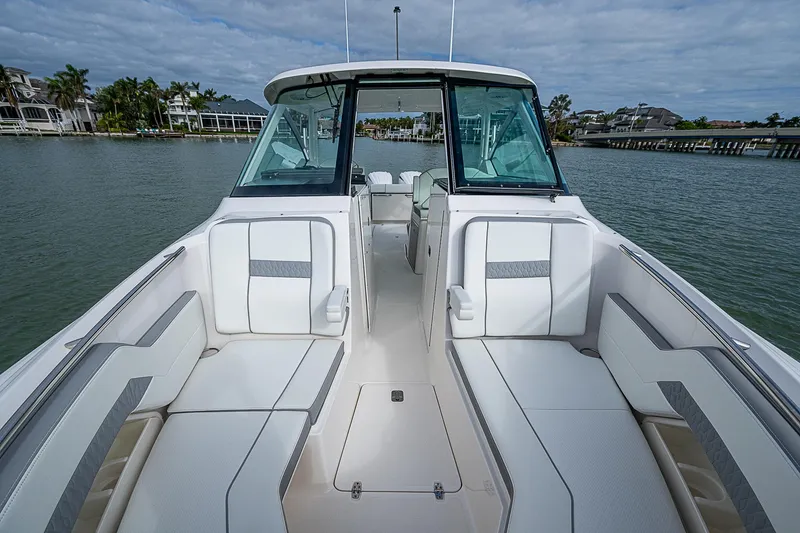 Slide: The Image of 2023 Pursuit DC 295 Dual Console boat interior with spacious seating and sleek design. - 13