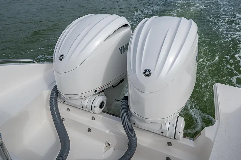 Slide: The Image of Twin Yamaha outboard engines on 2023 Pursuit DC 295 Dual Console boat. - 33