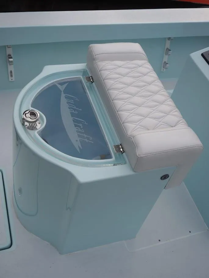 Slide: The Image of 2025 Cuda Craft 19 boat seat with quilted white cushion and storage compartment. - 10