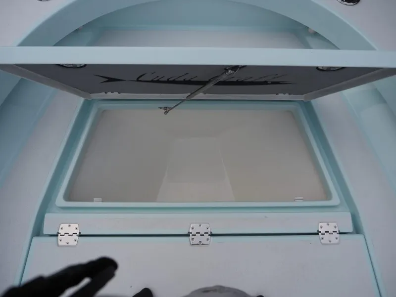 Slide: The Image of Cuda Craft 19 boat storage compartment, 2025 model, open lid view. - 11